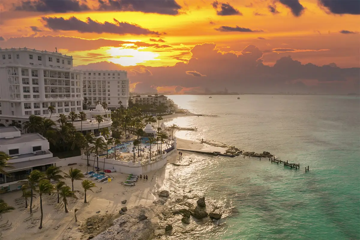 A hotel in Cancun from a drone’s perspective at sunset